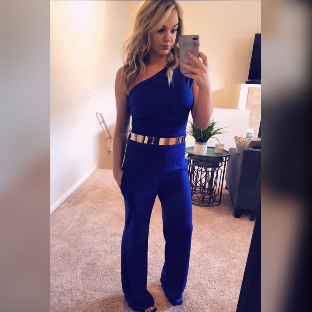 Women’s one shoulder jumpsuit and gold belt